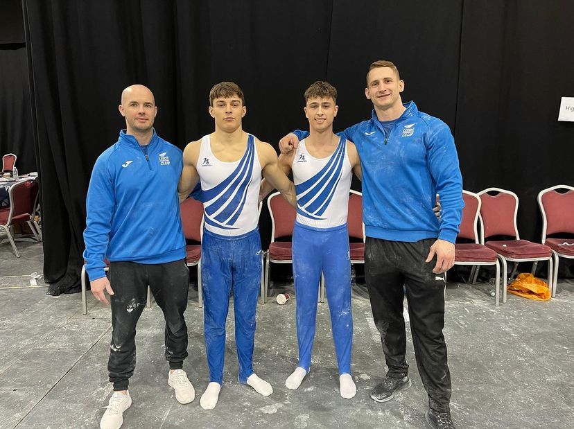Leeds gymnasts Ares Federici and Jake Johnson with coaches Andy Butcher and Tom Rawlinson at the English Championships 2023