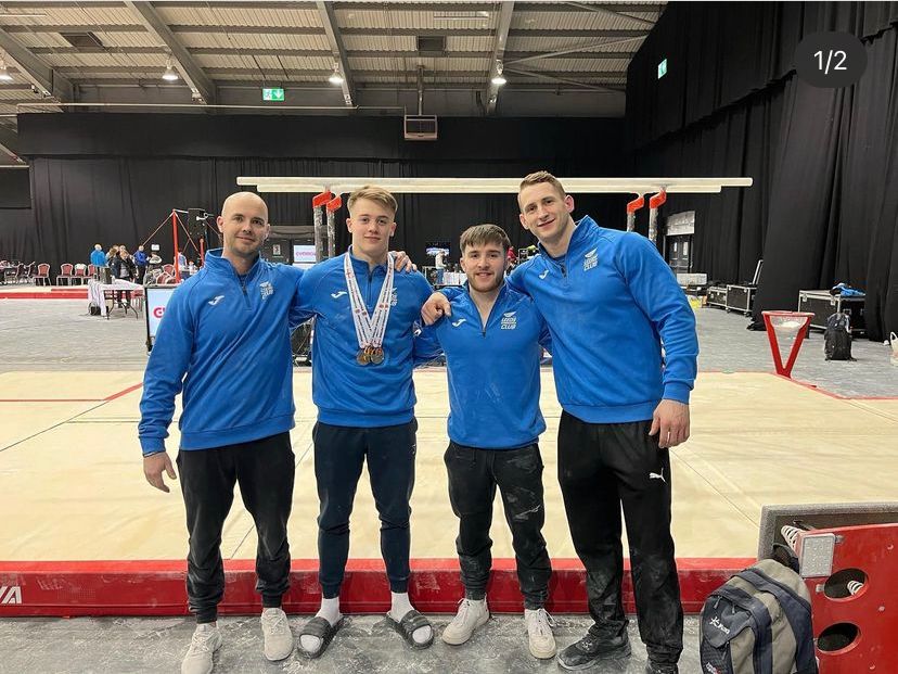 Leeds gymnasts Harry Hepworth and Luke Whitehouse with coaches Andy Butcher and Tom Rawlinson at the English Championships 2023